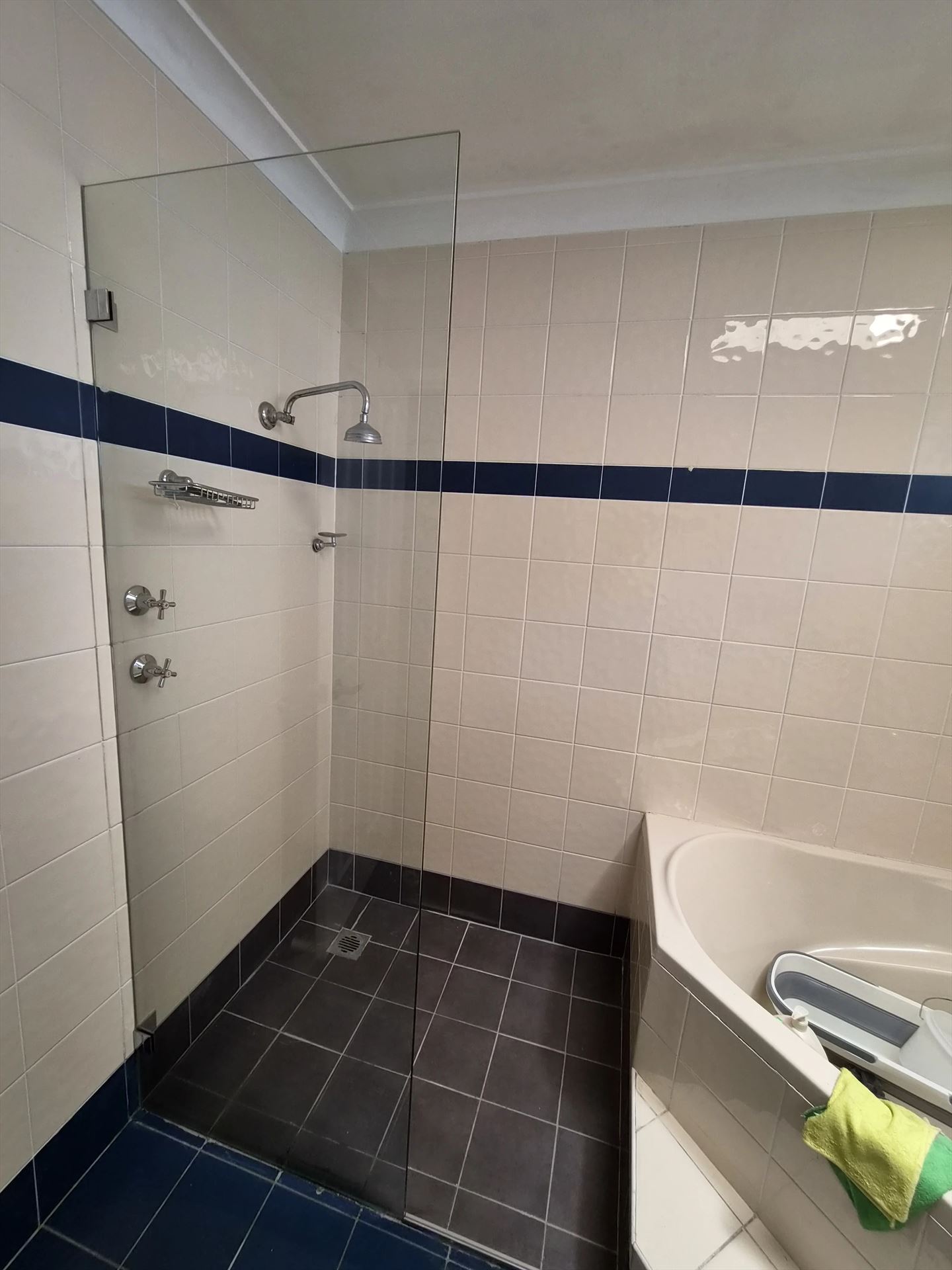frameless shower screen with chrome hardware installed in Greystanes by Showerland