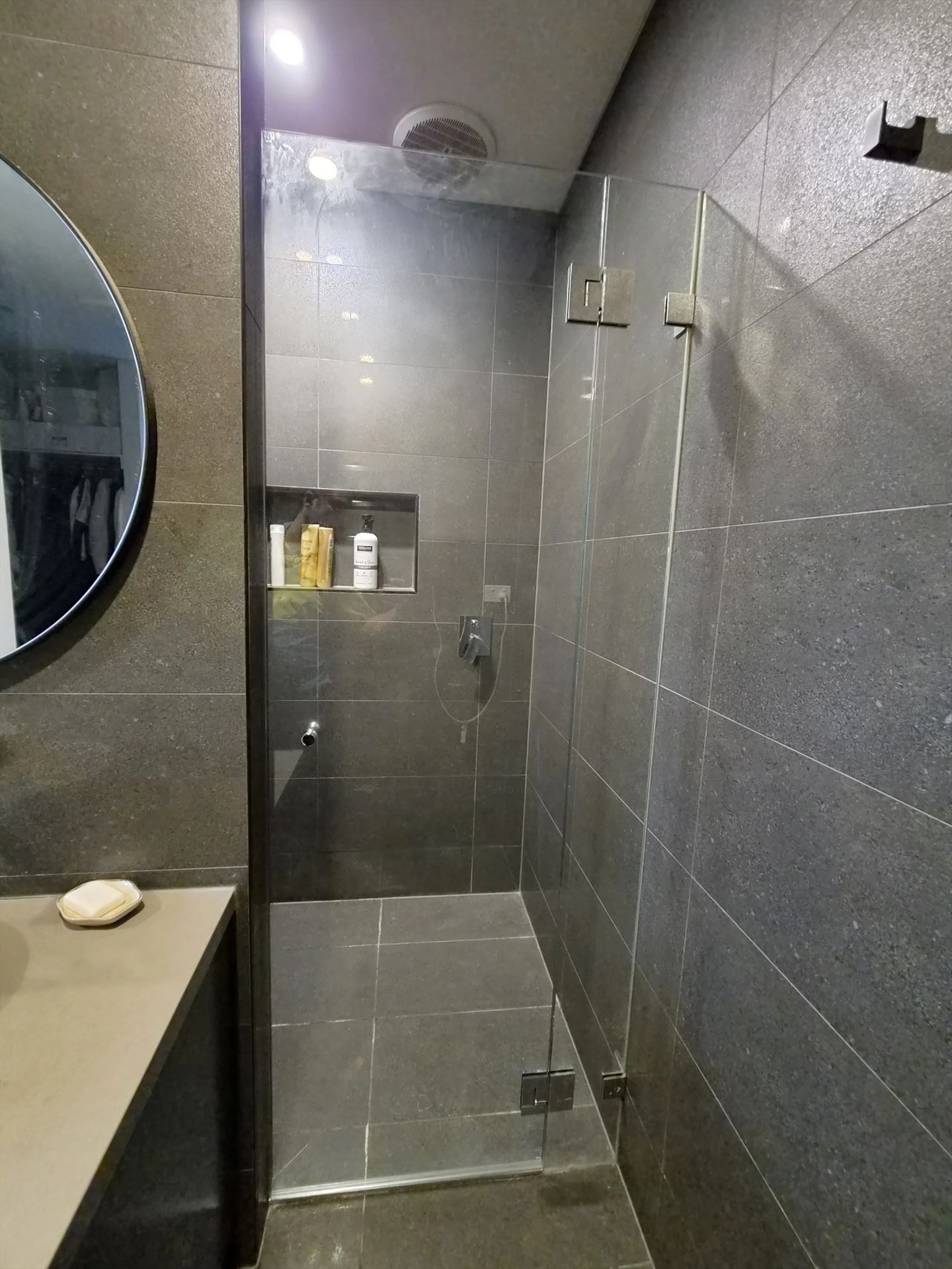frameless shower screen with chrome hardware installed in North Kellyville by Showerland