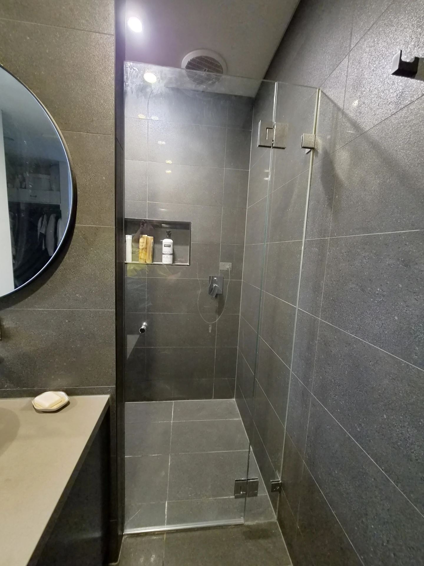 frameless shower screen with chrome hardware installed in North Kellyville by Showerland