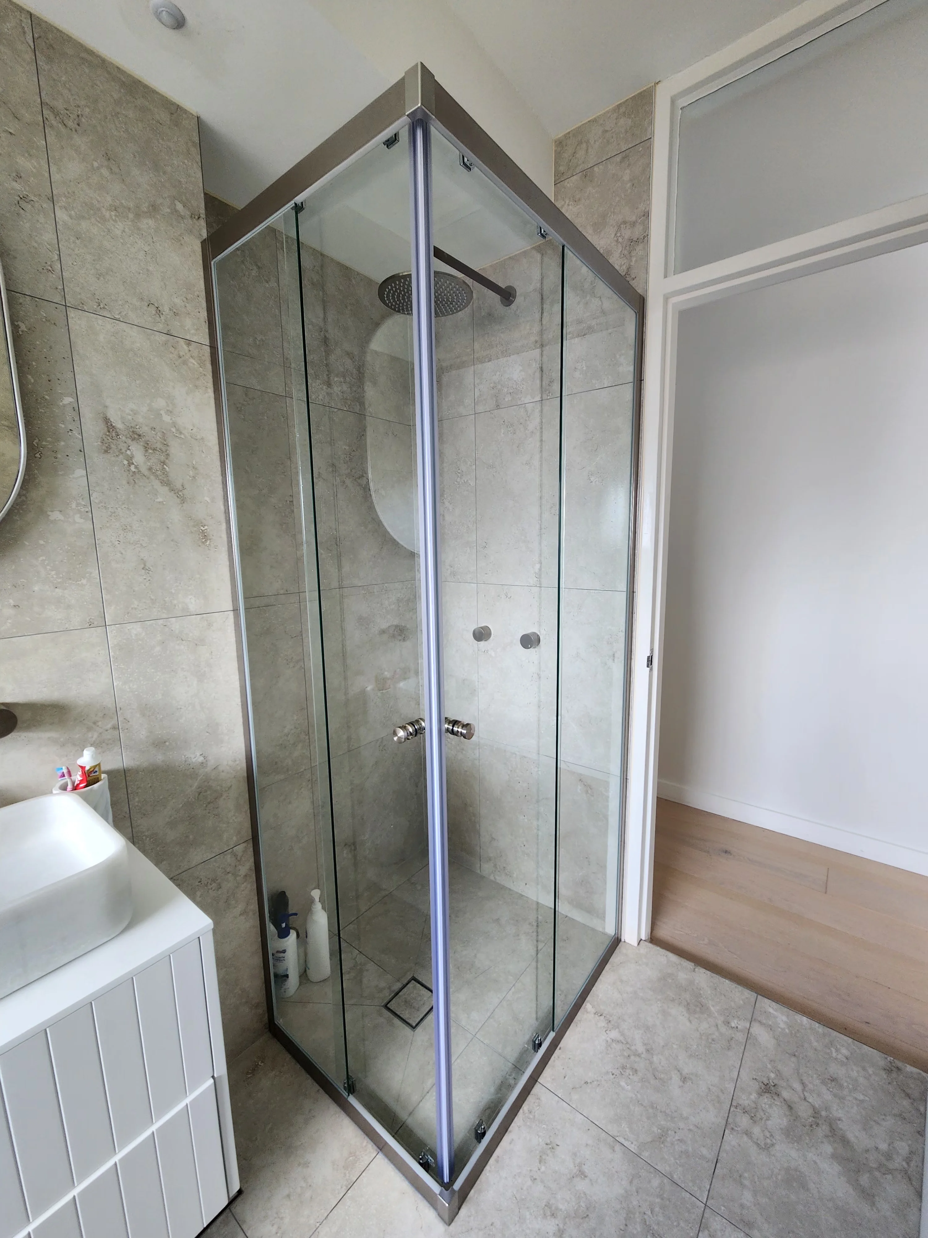 Custom shower screen with brushed nickel hardware, Sydney
