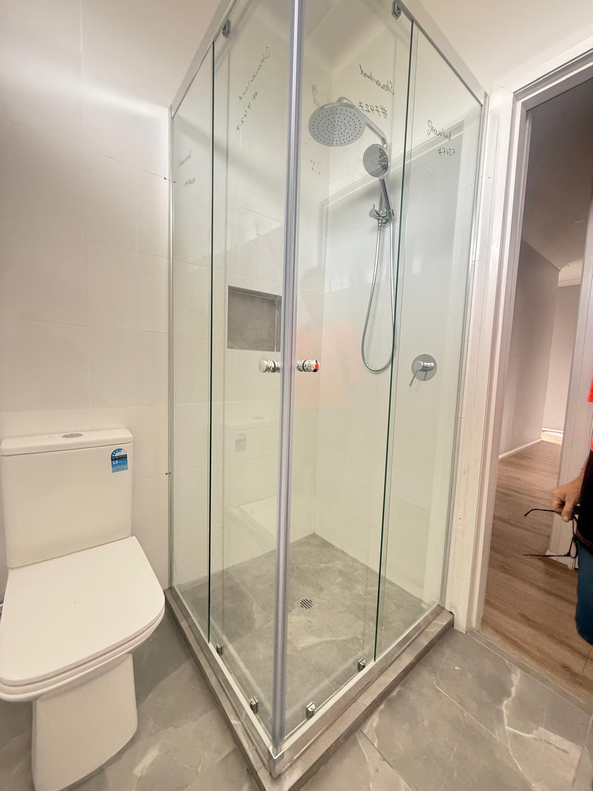 Corner-entry sliding semi-frameless shower screen Sydney