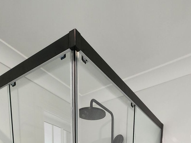 Close view of a slim shower screen frame and hinge in Baulkham Hills
