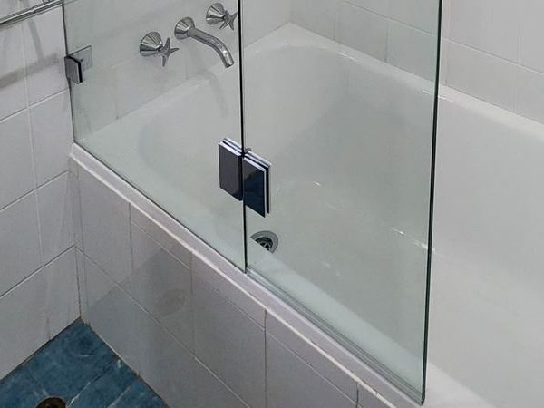 Shower screen repairs: a glass to glass hinge on a frameless door in North Curl Curl